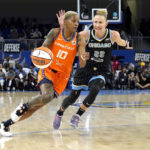 
              Connecticut Sun's Courtney Williams (10) drives to the basket as Chicago Sky's Courtney Vandersloot defends during the first half in Game 1 of a WNBA basketball semifinal playoff series Sunday, Aug. 28, 2022, in Chicago. (AP Photo/Charles Rex Arbogast)
            