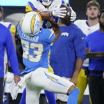 
              Los Angeles Rams wide receiver Lance McCutcheon, top, catches a touchdown pass over Los Angeles Chargers' Deane Leonard (33) during the first half of a preseason NFL football game Saturday, Aug. 13, 2022, in Inglewood, Calif. (AP Photo/Ashley Landis)
            