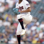 
              Minnesota Twins starting pitcher Chris Archer delivers winds up during the second inning of the team's baseball game against the Detroit Tigers o Tuesday, Aug. 2, 2022, in Minneapolis. (AP Photo/Abbie Parr)
            