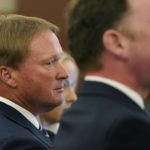 
              FILE - Jon Gruden listens in court Wednesday, May 25, 2022, in Las Vegas, where a judge heard a bid by the National Football League to dismiss former Las Vegas Raiders coach Jon Gruden's lawsuit, accusing the league of a "malicious and orchestrated campaign" including the leaking of offensive emails ahead of his resignation last October. Former Raiders coach Jon Gruden says he is “ashamed” about his old offensive emails that cost him his job and hopes to get another chance in football. Gruden spoke publicly Tuesday, Aug. 30 about the affair at the Little Rock Touchdown Club for the first time since he resigned as coach of the Raiders last October.(AP Photo/John Locher, File)
            