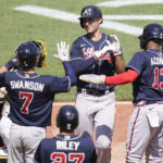 
              Atlanta Braves' Matt Olson, center, is greeted by Ronald Acuna Jr. (13) after driving him, Austin Riley (27) and Dansby Swanson (7) in with a grand-slam home run during the eighth inning of a baseball game against the Pittsburgh Pirates, Wednesday, Aug. 24, 2022, in Pittsburgh. (AP Photo/Keith Srakocic)
            