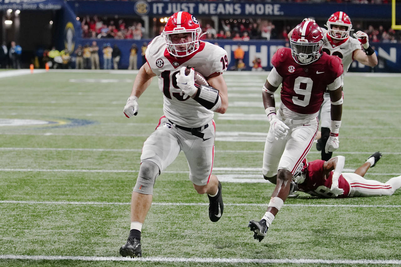 FILE - Georgia tight end Brock Bowers (19) runs into the end zone for a touchdown against Alabama d...