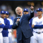 
              FILE - Los Angeles Dodgers broadcaster Vin Scully speaks during his induction into the team's Ring of Honor prior to a baseball game between the Dodgers and the San Francisco Giants in Los Angeles on May 3, 2017, in Los Angeles. Scully, whose dulcet tones provided the soundtrack of summer while entertaining and informing Dodgers fans in Brooklyn and Los Angeles for 67 years, died Tuesday night, Aug. 2, 2022, the team said. He was 94. (AP Photo/Mark J. Terrill, File)
            