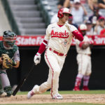 
              Los Angeles Angels' Shohei Ohtani (17), of Japan, strikes out during the third inning of a baseball game against the Oakland Athletics, Thursday, Aug. 4, 2022, in Anaheim, Calif. (AP Photo/Jae C. Hong)
            