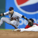 
              Detroit Tigers shortstop Javier Baez tags out Cleveland Guardians' Steven Kwan attempting to steal second base during the seventh inning of a baseball game Tuesday, Aug. 16, 2022, in Cleveland. (AP Photo/Ron Schwane)
            