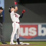 
              Minnesota Twins' Gio Urshela celebrates after hitting a three-run double during the fifth inning of a baseball game against the Boston Red Sox, Monday, Aug. 29, 2022, in Minneapolis. (AP Photo/Abbie Parr)
            