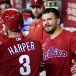 
              Philadelphia Phillies' Bryce Harper (3) is congratulated by Kyle Schwarber, right, after Harper scored against the Arizona Diamondbacks during the third inning of a baseball game Wednesday, Aug. 31, 2022, in Phoenix. (AP Photo/Ross D. Franklin)
            