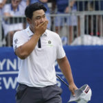 
              Joohyoung Kim, right, of South Korea, reacts after winning the Wyndham Championship golf tournament in Greensboro, N.C., Sunday, Aug. 7, 2022. (AP Photo/Chuck Burton)
            