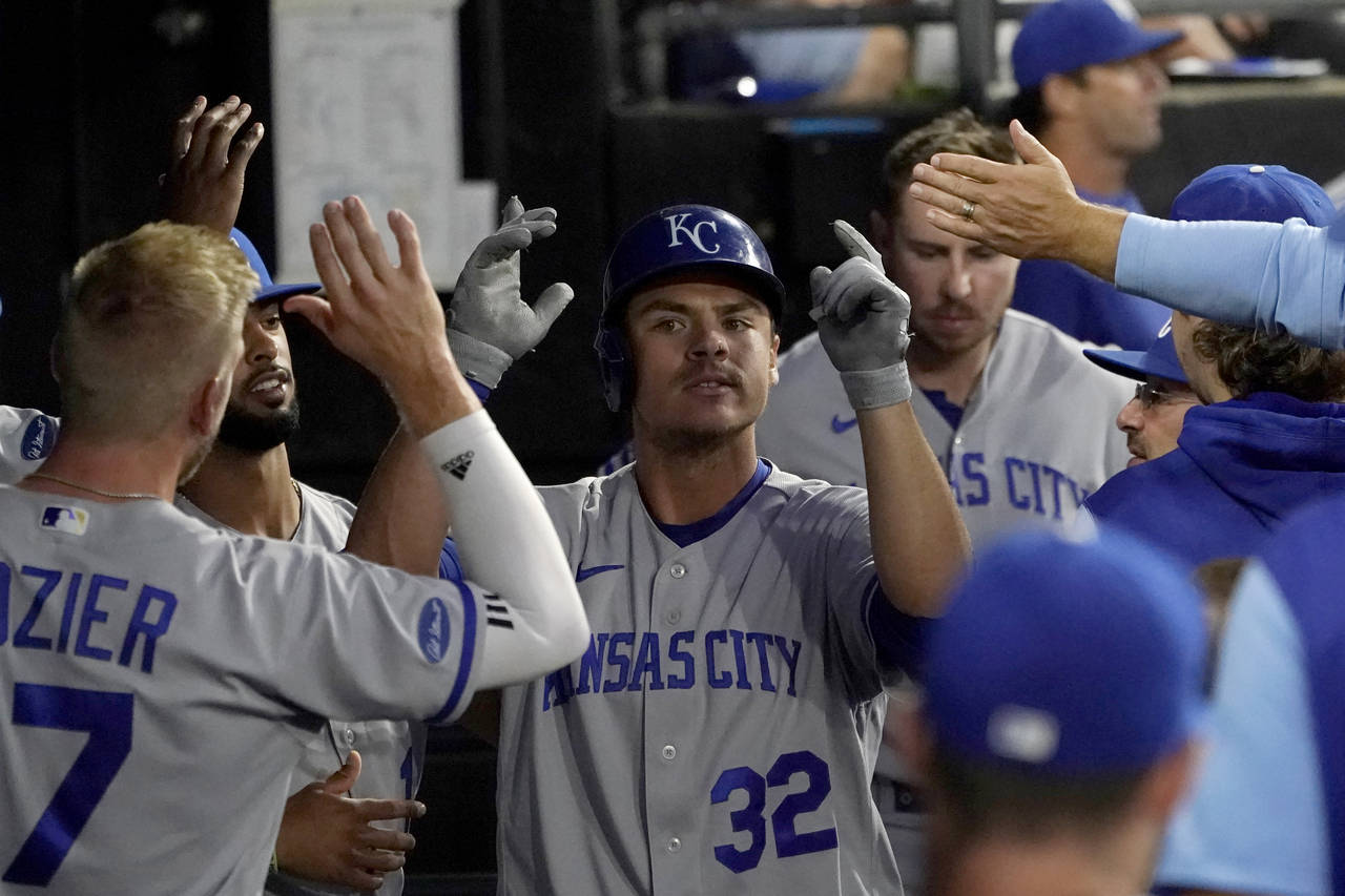 Kansas City Royals' Nick Pratto is congratulated in the dugout after his home run off Chicago White...