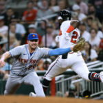 
              Atlanta Braves' Michael Harris II (23) is put out at first base by New York Mets first baseman Pete Alonso (20) on a ground ball during the fourth inning of a baseball game Monday, Aug. 15, 2022, in Atlanta. (AP Photo/John Bazemore)
            