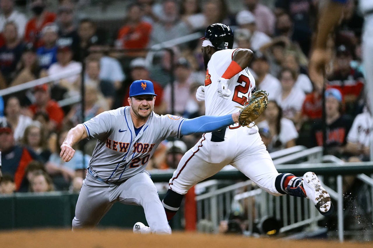 Atlanta Braves' Michael Harris II (23) is put out at first base by New York Mets first baseman Pete...