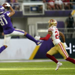 
              Minnesota Vikings wide receiver Bisi Johnson (81) catches a pass over San Francisco 49ers cornerback Ka'dar Hollman (24) during the first half of a preseason NFL football game, Saturday, Aug. 20, 2022, in Minneapolis. (AP Photo/Abbie Parr)
            