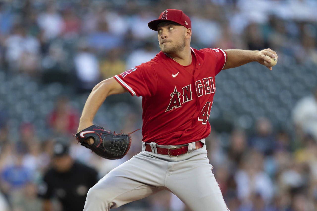 Los Angeles Angels starter Reid Detmers delivers a pitch during the first inning of the second game...