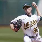 
              Oakland Athletics' JP Sears pitches against the Seattle Mariners during the first inning of a baseball game in Oakland, Calif., Sunday, Aug. 21, 2022. (AP Photo/Godofredo A. Vásquez)
            