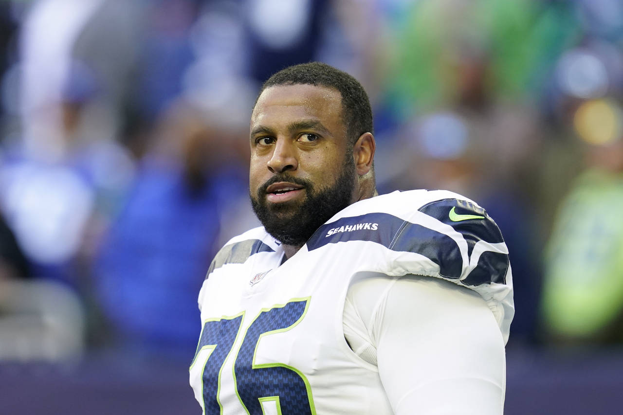 FILE - Seattle Seahawks offensive lineman Duane Brown (76) looks on during pregame warmups before a...
