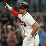 
              Atlanta Braves' Matt Olson gestures as he runs the bases after hitting a two-run home run during the fourth inning of the team's baseball game against the New York Mets on Tuesday, Aug. 16, 2022, in Atlanta. (AP Photo/John Bazemore)
            