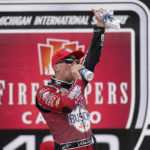 
              Kevin Harvick celebrates after winning the NASCAR Cup Series auto race at the Michigan International Speedway in Brooklyn, Mich., Sunday, Aug. 7, 2022. (AP Photo/Paul Sancya)
            