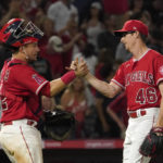 
              Los Angeles Angels catcher Matt Thaiss, left, and relief pitcher Jimmy Herget congratulate each other after the Angels defeated the New York Yankees 4-3 in a baseball game Monday, Aug. 29, 2022, in Anaheim, Calif. (AP Photo/Mark J. Terrill)
            