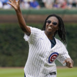
              Buck O'Neil's great niece Grace O'Neil throws out a ceremonial first pitch before a baseball game between Milwaukee Brewers and the Chicago Cubs in Chicago, Saturday, Aug. 20, 2022. (AP Photo/Nam Y. Huh)
            