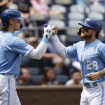 
              Kansas City Royals' Bobby Witt Jr. (7) congratulates Kyle Isbel (28) after scoring off a MJ Melendez single during the third inning of a baseball game against the Boston Red Sox in Kansas City, Mo., Sunday, Aug. 7, 2022. (AP Photo/Colin E. Braley)
            