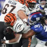 
              New York Giants defensive end Ryder Anderson (90) tackles Cincinnati Bengals' Chris Evans (25) during the first half of a preseason NFL football game Sunday, Aug. 21, 2022, in East Rutherford, N.J. (AP Photo/John Minchillo)
            