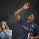 
              FILE - Minnesota Lynx center Sylvia Fowles waves to the crowd after WNBA commissioner Cathy Engelbert presented her with the trophy for being named WNBA Defensive Player of the Year, at a WNBA basketball game between the Lynx and Chicago Sky, Sunday, Sept. 26, 2021, in Minneapolis. One of the league's greatest centers is ready to move on to another career in mortuary science, no longer possessing the energy to stay in basketball shape. (Jeff Wheeler/Star Tribune via AP, File)
            