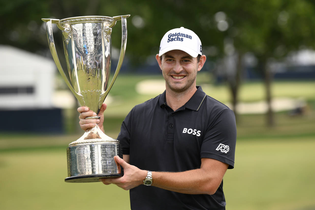 Patrick Cantlay holds the FedEx cup trophy after winning the the BMW Championship golf tournament a...