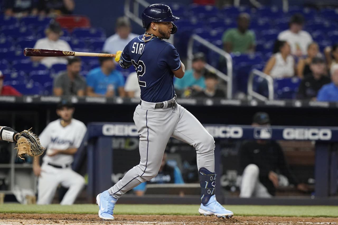 Tampa Bay Rays' Jose Siri (22) hits a single in the fifth inning of a baseball game against the Mia...