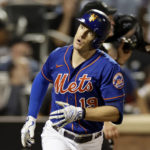 
              New York Mets' Mark Canha reacts after hitting a home run against the Los Angeles Dodgers during the fourth inning of a baseball game Tuesday, Aug. 30, 2022, in New York. (AP Photo/Adam Hunger)
            