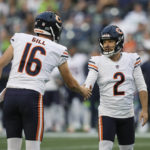 
              Chicago Bears kicker Cairo Santos (2) is greeted by holder Trenton Gill (16) after Santos kicked a field goal against the Seattle Seahawks during the second half of a preseason NFL football game, Thursday, Aug. 18, 2022, in Seattle. (AP Photo/Stephen Brashear)
            