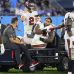 
              Tampa Bay Buccaneers guard Aaron Stinnie is taken off the field after being injured in the second half of a preseason NFL football game against the Tennessee Titans Saturday, Aug. 20, 2022, in Nashville, Tenn. (AP Photo/Mark Zaleski)
            