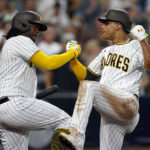 
              San Diego Padres' Juan Soto, right, celebrates with Josh Bell after hitting a home run against the San Francisco Giants during the fourth inning of a baseball game Tuesday, Aug. 9, 2022, in San Diego. (AP Photo/Gregory Bull)
            