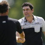 
              Keegan Bradley, right, shakes the hand of Adam Scott, of Australia, left, after they finished their round on the 18th green during the first round of the BMW Championship golf tournament at Wilmington Country Club, Thursday, Aug. 18, 2022, in Wilmington, Del. (AP Photo/Nick Wass)
            