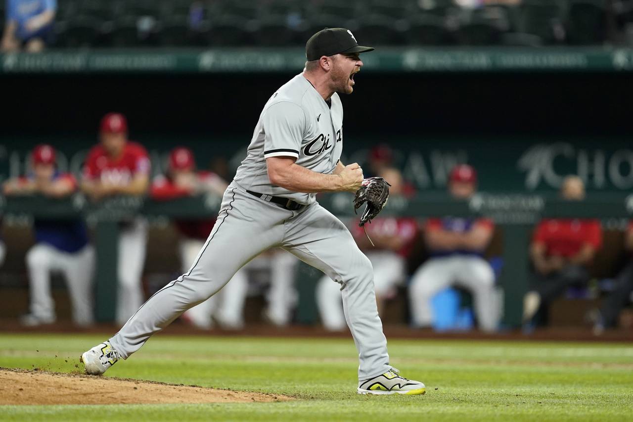 Chicago White Sox relief pitcher Liam Hendriks celebrates after getting the final out in the team's...
