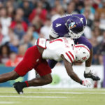 
              Northwestern running back Cam Porter (4) fumbles the ball as he is tackled by Nebraska defensive back Marques Buford (1) during the second half of an NCAA college football game, Saturday, Aug. 27, 2022, at Aviva Stadium in Dublin, Ireland. (AP Photo/Peter Morrison)
            