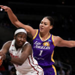 
              FILE - Washington Mystics center Elizabeth Williams, left, gets a rebound next to Los Angeles Sparks center Liz Cambage during the first half of a WNBA basketball game Tuesday, July 12, 2022, in Los Angeles. Cambage announced on social media that she decided to step away from the WNBA “for the time being” addressing for the first time her contract divorce from the Los Angeles Sparks last month. (Keith Birmingham/The Orange County Register via AP, File)
            