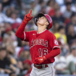
              Los Angeles Angels' Mickey Moniak celebrates after hitting a solo home run off Seattle Mariners starting pitcher Chris Flexen during the fourth inning of the second game of a baseball doubleheader, Saturday, Aug. 6, 2022, in Seattle. (AP Photo/Stephen Brashear)
            