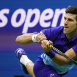 
              FILE - Novak Djokovic, of Serbia, returns a shot to Alexander Zverev, of Germany, during the semifinals of the U.S. Open tennis championships, Friday, Sept. 10, 2021, in New York. Djokovic will not play in the U.S. Open, as expected, because he is not vaccinated against COVID-19 and thus is not allowed to travel to the United States. Djokovic announced his withdrawal from the year’s last Grand Slam tournament on Twitter on Thursday, Aug. 25, 2022, hours before the draw for the event was revealed.  (AP Photo/John Minchillo, File)
            