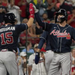 
              Atlanta Braves' Dansby Swanson, right, is congratulated by teammate Robbie Grossman (15) after hitting a three-run home run during the seventh inning of a baseball game against the St. Louis Cardinals Sunday, Aug. 28, 2022, in St. Louis. (AP Photo/Jeff Roberson)
            