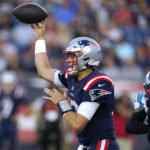 
              New England Patriots quarterback Mac Jones throws a pass against the Carolina Panthers during the first half of a preseason NFL football game Friday, Aug. 19, 2022, in Foxborough, Mass. (AP Photo/Michael Dwyer)
            