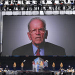 
              A video of NFL official Art McNally is played pose during an induction ceremony at the Pro Football Hall of Fame in Canton, Ohio, Saturday, Aug. 6, 2022. (AP Photo/David Dermer)
            