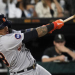 
              Detroit Tigers' Javier Baez hits a single during the seventh inning of a baseball game against the Chicago White Sox in Chicago, Friday, Aug. 12, 2022. (AP Photo/Nam Y. Huh)
            
