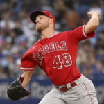
              Los Angeles Angels starting pitcher Reid Detmers throws to a Toronto Blue Jays batter in the first inning of a baseball game in Toronto, Friday, Aug. 26, 2022. (Jon Blacker/The Canadian Press via AP)
            