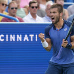 
              Borna Coric, of Croatia, reacts after scoring a point against Stefanos Tsitsipas, of Greece, during the men's singles final of the Western & Southern Open tennis tournament, Sunday, Aug. 21, 2022, in Mason, Ohio. (AP Photo/Jeff Dean)
            