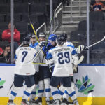 
              Finland celebrates a goal against Sweden during the second period of a semifinal in the IIHF world junior hockey championships Friday, Aug. 19, 2022, in Edmonton, Alberta. (Jason Franson/The Canadian Press via AP)
            