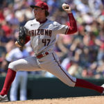 
              Arizona Diamondbacks starting pitcher Tommy Henry delivers during the third inning of a baseball game against the Cleveland Guardians, Wednesday Aug. 3, 2022, in Cleveland. (AP Photo/David Dermer)
            
