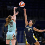 
              New York Liberty guard Sabrina Ionescu (20) has her shot blocked by Dallas Wings guard Veronica Burton (12) during the first half of a WNBA basketball game in Arlington, Texas, Wednesday, Aug. 10, 2022. (AP Photo/Tony Gutierrez)
            