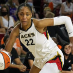 
              FILE - Las Vegas Aces forward A'ja Wilson (22) plays during the first half of a WNBA basketball game against the Phoenix Mercury, Sunday, Oct. 3, 2021, in Phoenix. Wilson was named AP Defensive Player of the Year Tuesday, Aug. 16, 2022. (AP Photo/Rick Scuteri, File)
            