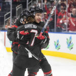 
              Canada's William Dufour (25) and Ridly Ridly Greig (17) celebrate a goal against Finland during the second period of an IIHF world junior hockey championships game Monday, Aug. 15, 2022, in Edmonton, Alberta. (Jason Franson/The Canadian Press via AP)
            