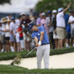 
              Adam Scott, of Australia, hits toward the 18th green during the final round of the BMW Championship golf tournament at Wilmington Country Club, Sunday, Aug. 21, 2022, in Wilmington, Del. (AP Photo/Nick Wass)
            